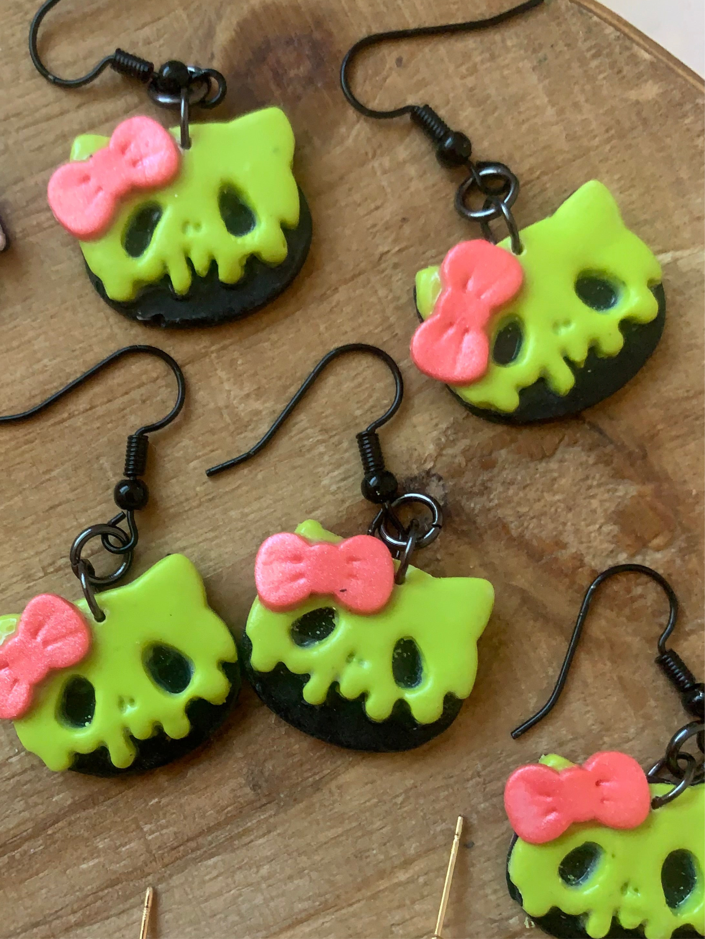 Poison cat earrings