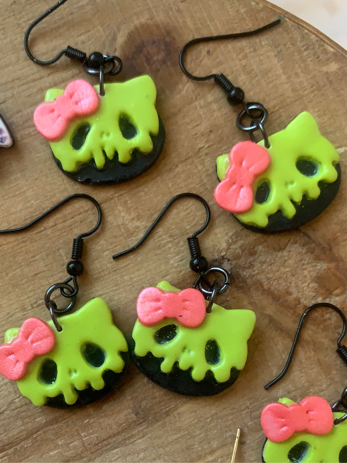 Poison cat earrings