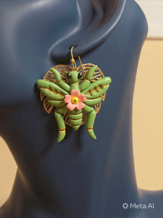 Grasshopper earrings on a leaf